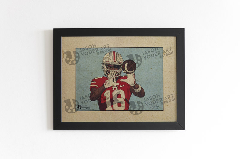 Limited edition Marvin Harrison, Jr. print, mocked up in a black frame, hanging on a white wall.